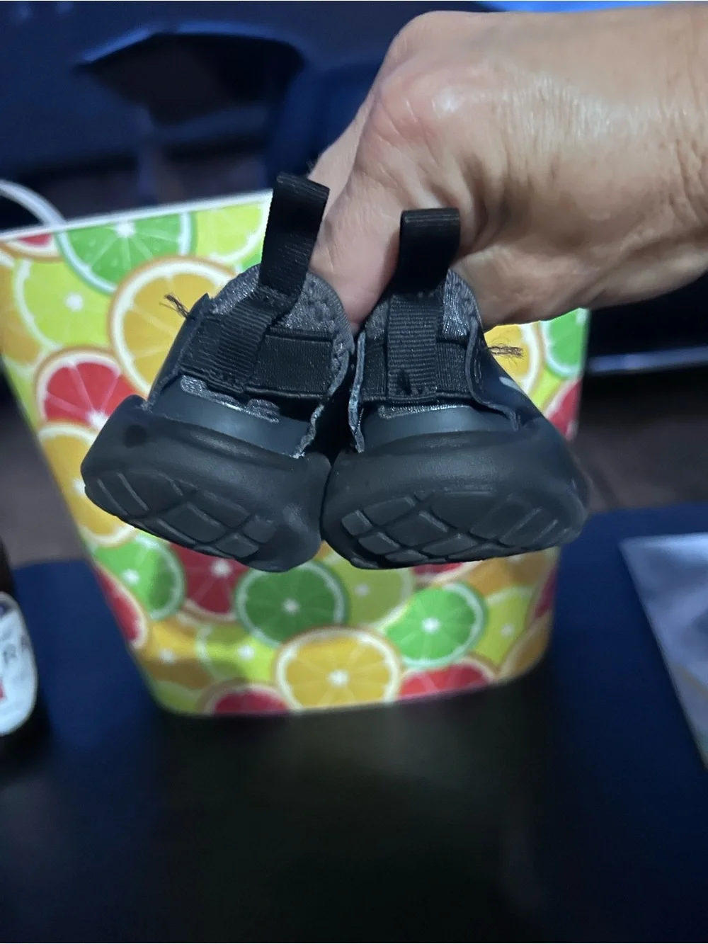 Nike Youth Black Slip-On Sneaker with White Swoosh and Blue Insole